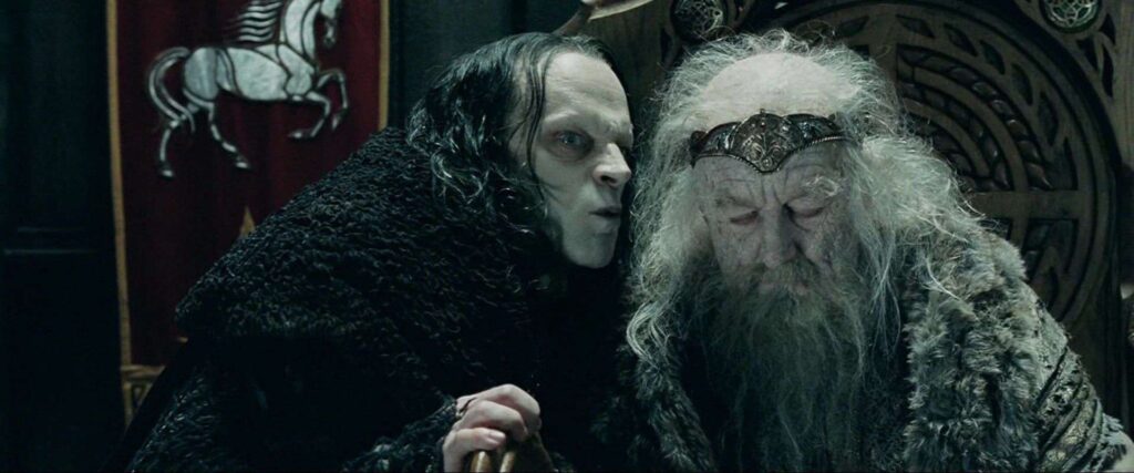 Still from Lord of the Rings: Wyrmtongue whispering into the ear of a decrepit looking King Theoden.